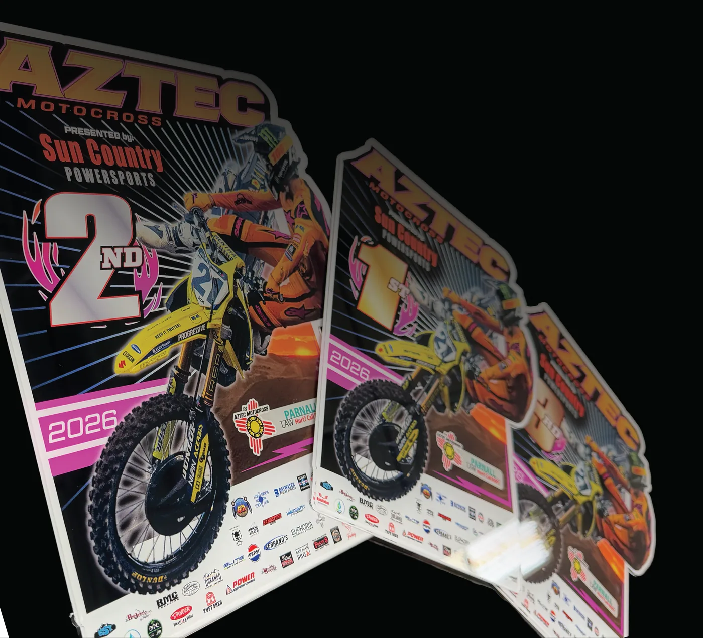Laser cut Aztec Motocross acrylic award plates in a row