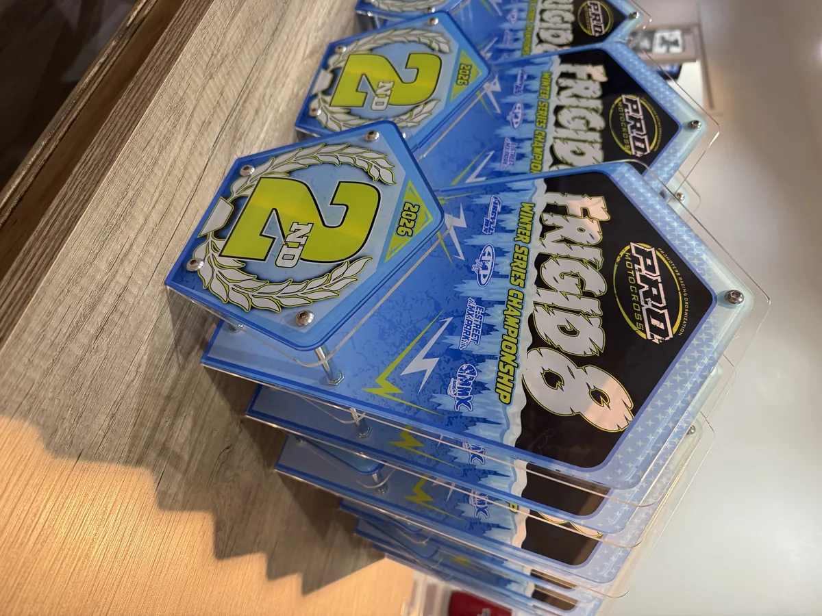 Stack of finished NCIDB championship award plates ready to ship